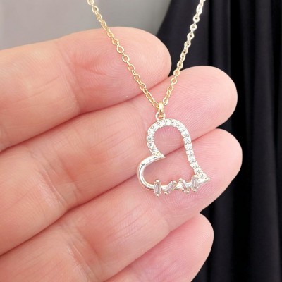 Baget Taş Detaylı Kalp Tasarım Zirkon Çelik Kolye - Gold Renk - Işıltılı Model Baget Taş Detaylı Kalp Tasarım Zirkon Çelik Kolye - Gold Renk - Işıltılı Model